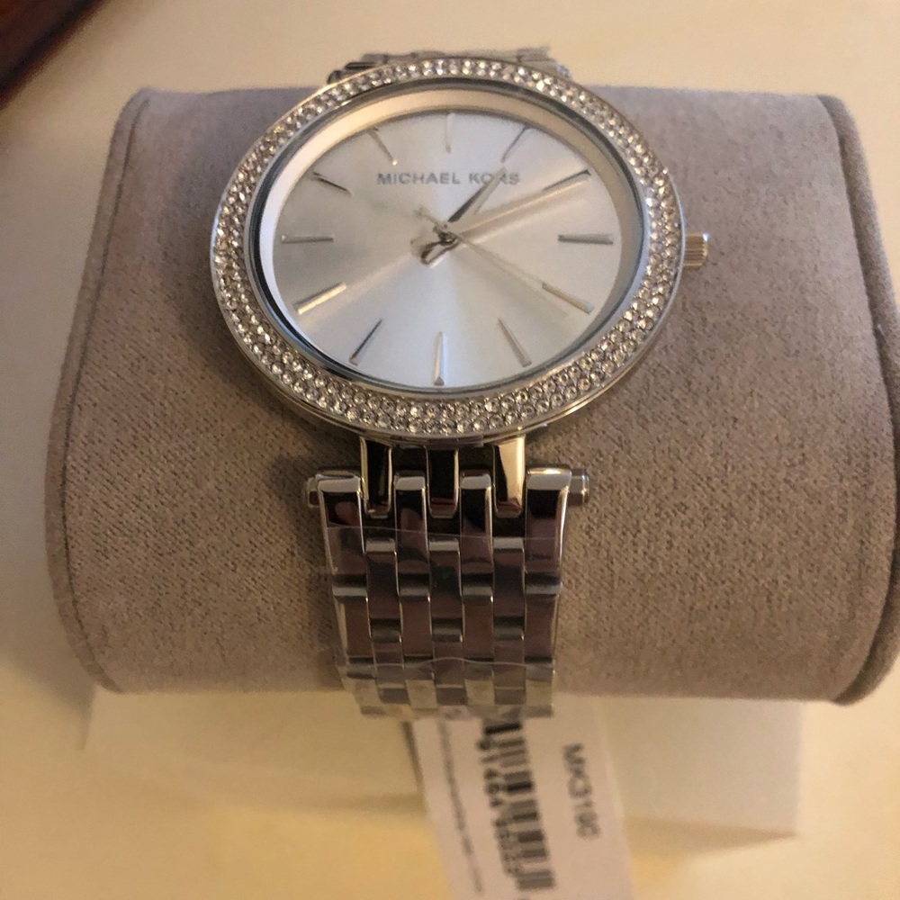 Cubic zirconia bezeled silver Michael Kors Watch.